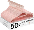 SONGMICS Pack of 50 Coat Hangers, Space-Saving Plastic Clothes Hangers, Non-Slip, 0.2 Inches Slim, 16.5 Inches Wide, 360° Swivel Rose Gold Hook, Light Pink UCRP20PK05